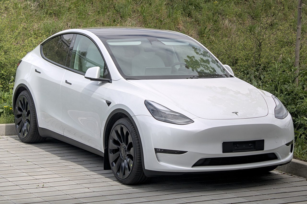 2025 Tesla Model Y electric SUV in white