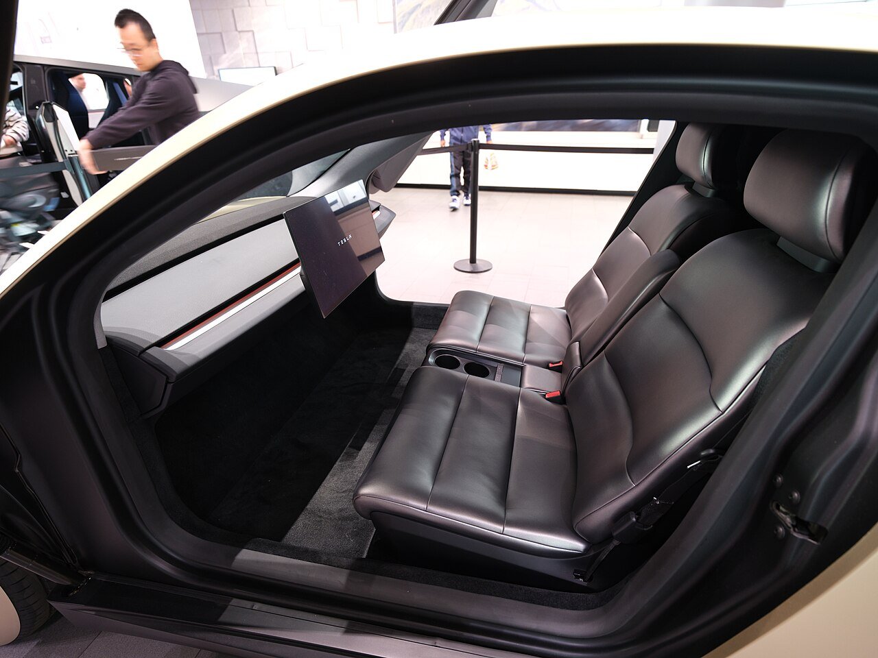Tesla Cybercab interior with no steering wheel and a large center screen