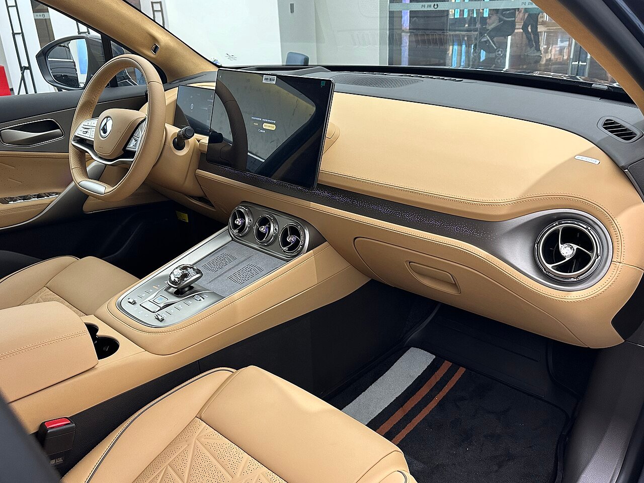 Denza N8 cabin with tan leather seats, large center touchscreen and turbine-style air vents