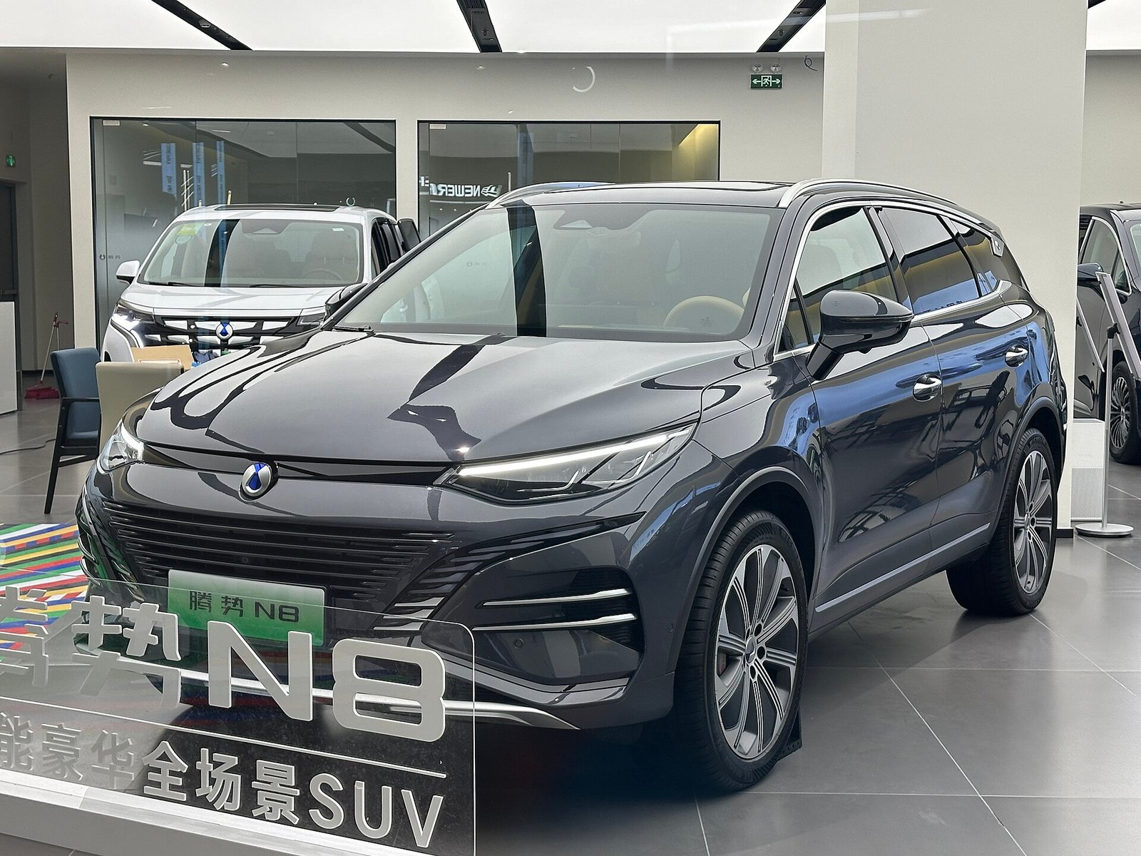 Denza N8 plug-in hybrid front three-quarter view in a showroom