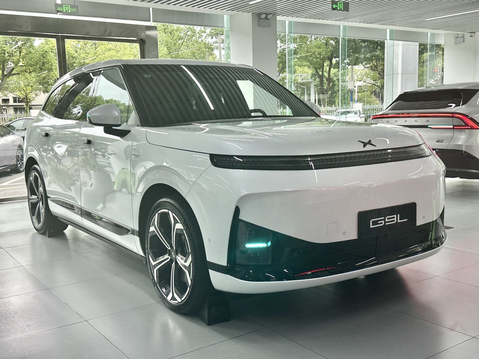 White XPeng G9L three-row electric SUV shown in profile