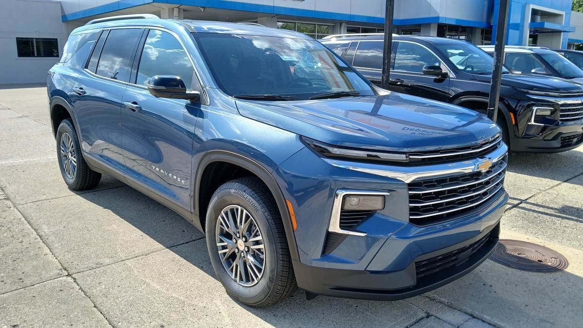 A 2024 Chevrolet Traverse at a dealership — GM plans a hybrid version of its three-row SUV