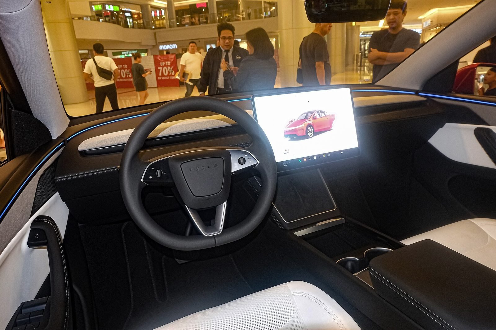 The cabin of a Tesla Model Y with its central touchscreen. Tesla’s driver-assist naming is under pressure on both sides of the Atlantic.