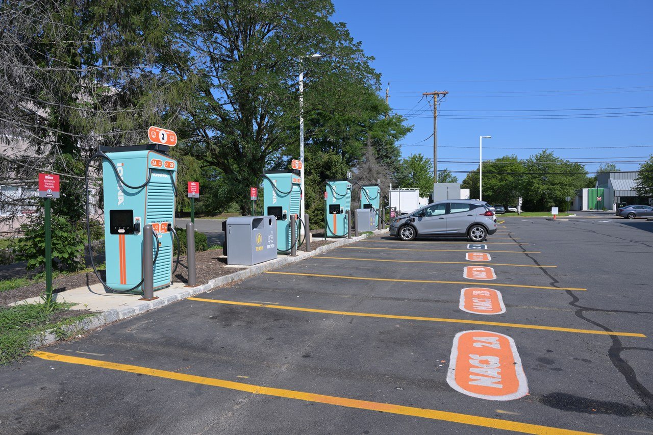 A gray Chevrolet Bolt charging at an IONNA fast-charging station at a Wawa in Kendall Park, New Jersey, in July 2026