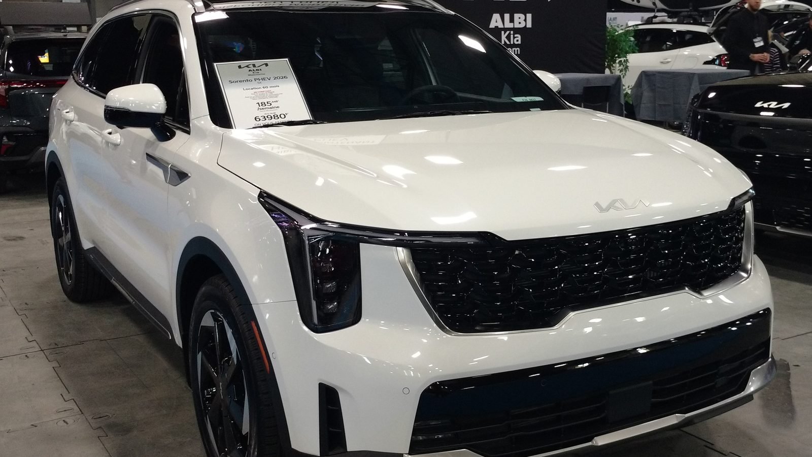 2026 Kia Sorento PHEV on display at an auto show, front three-quarter view