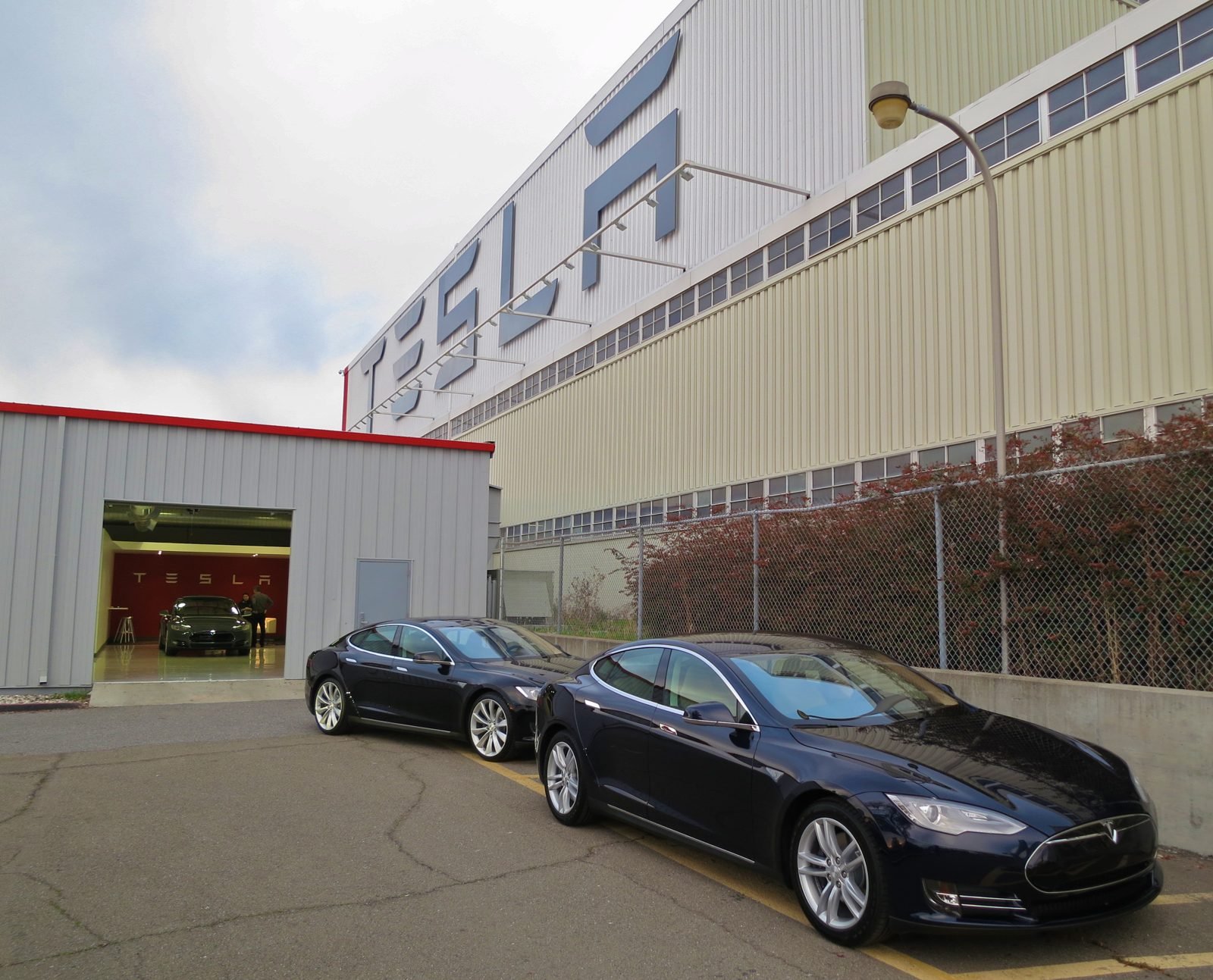 Rows of new Tesla vehicles at the factory