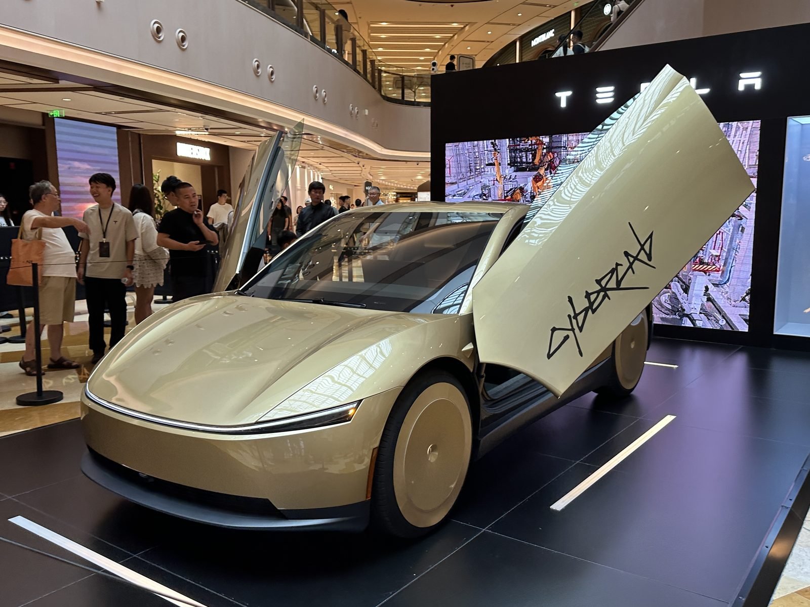 Tesla Cybercab with butterfly doors open — Tesla's robotaxi push is central to the Q3 2026 story