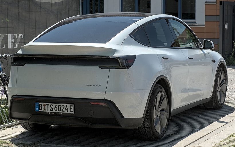 White 2025 Tesla Model Y Dual Motor, rear view