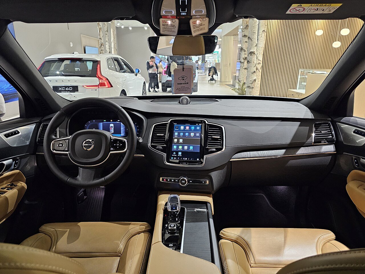 2026 Volvo XC90 cabin with amber leather seats and freestanding touchscreen